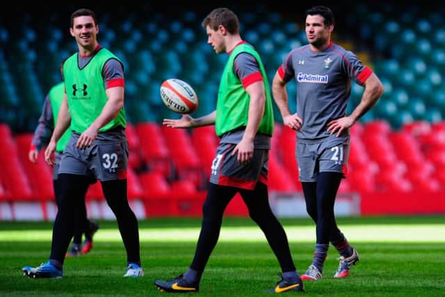 George North, left, shares a joke with Rhys Priestland as Mike Phillips, right, looks on. Picture: Getty