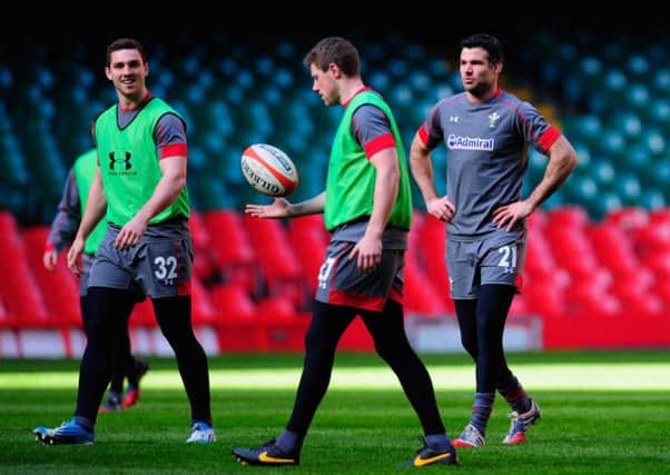 George North, left, shares a joke with Rhys Priestland as Mike Phillips, right, looks on. Picture: Getty