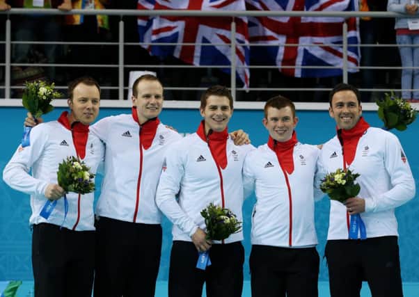 The Great Britain team on the podium ahead of receiving their silver medals. Picture: PA