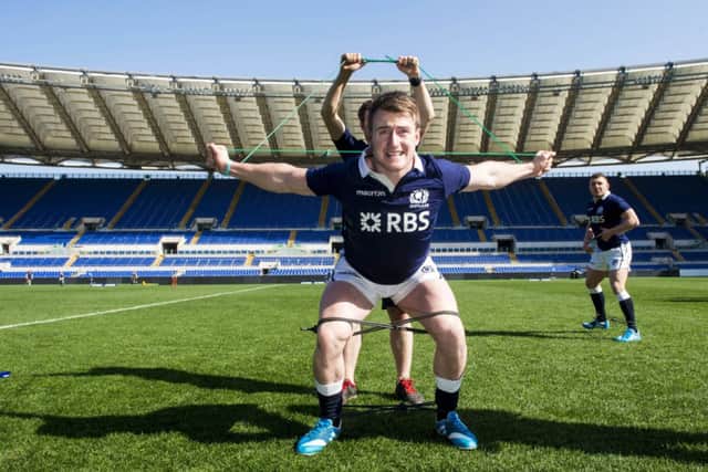 Stuart Hogg limbers up ahead of the Six Nations match against Italy in Rome. Picture: SNS