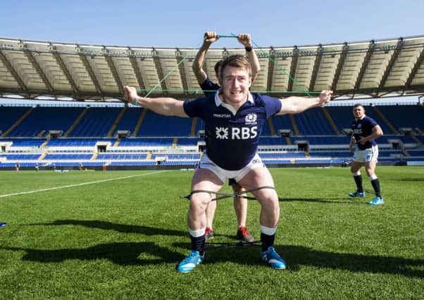Stuart Hogg limbers up ahead of the Six Nations match against Italy in Rome. Picture: SNS
