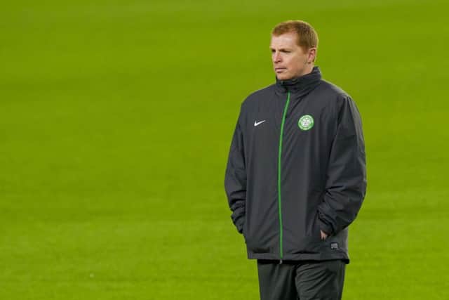 Celtic manager Neil Lennon keeps an eye on training. Picture: SNS