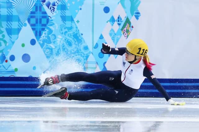 Elise Christie crashes to the floor after tangling with Li Jianrou. Picture: Getty