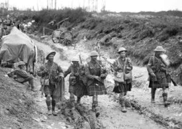 A piper of the 7th Seaforth Highlanders leads four men of the 26th Brigade after the attack on Longueval on 14 July, 1916.  Picture: Getty
