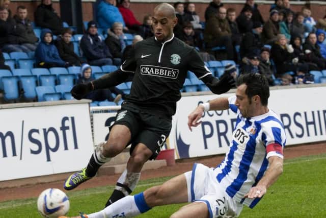 Kilmarnock's Manuel Pascali slides in on Hibs' Danny Haynes. Picture: SNS