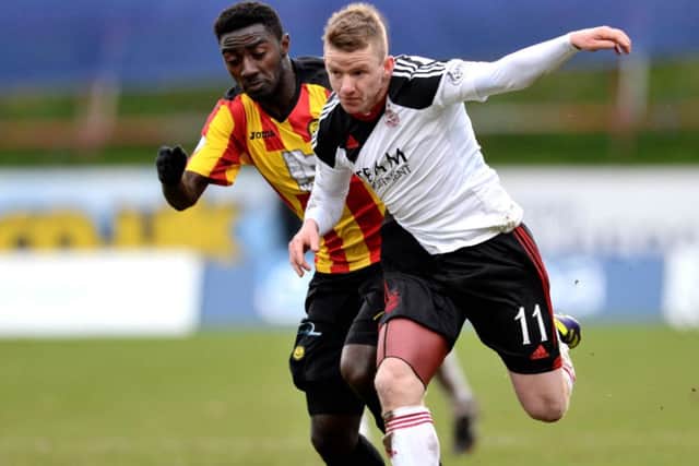 Partick's Prince Buaben chases down Jonny Hayes. Picture: SNS