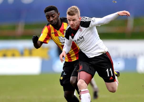 Partick's Prince Buaben chases down Jonny Hayes. Picture: SNS