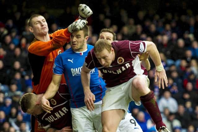 Stenhousemuir keeper Chris Smith punches clear of Rangers' Andrew Little. Picture: SNS