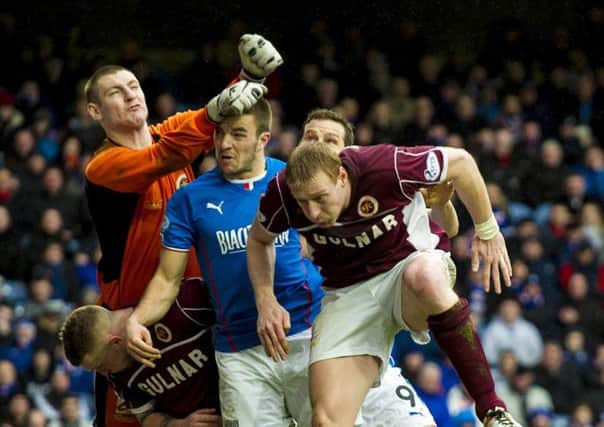 Stenhousemuir keeper Chris Smith punches clear of Rangers' Andrew Little. Picture: SNS