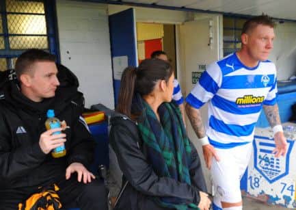 Derek Riordan, left, sits on the Alloa Athletic bench as Garry OConnor takes the field with Morton. Picture: Robert Perry