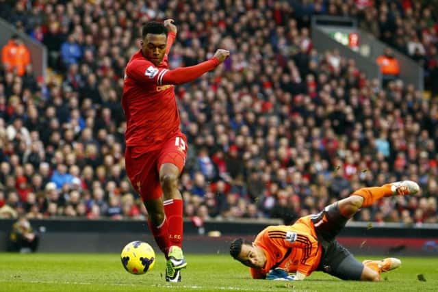 Liverpools Daniel Sturridge sweeps past goalkeeper Michel Vorm. Picture: Reuters