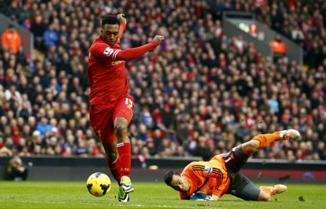 Liverpools Daniel Sturridge sweeps past goalkeeper Michel Vorm. Picture: Reuters