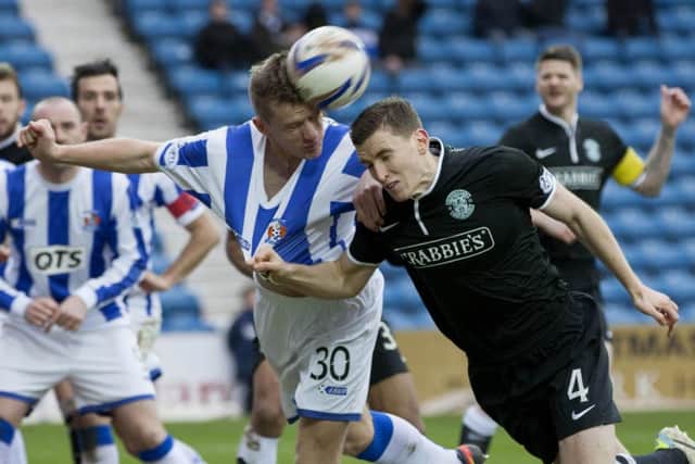 Kilmarnocks Lee Ashcroft and Hibs Paul Hanlon engage in a head-to-head challenge. Picture: SNS
