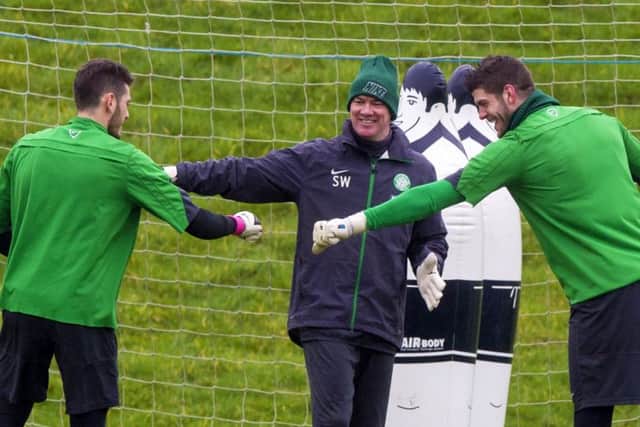 Fraser Forster, right, enjoys a light-hearted moment in training yesterday. Picture: SNS