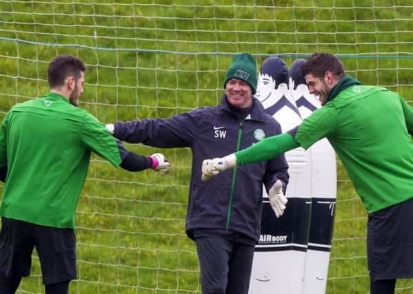 Fraser Forster, right, enjoys a light-hearted moment in training yesterday. Picture: SNS