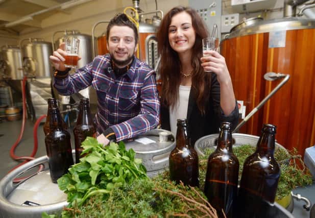 Patrick Jones from Pilot and Kelsey Wood of The Vintage toast their new beer. Picture: Phil Wilkinson