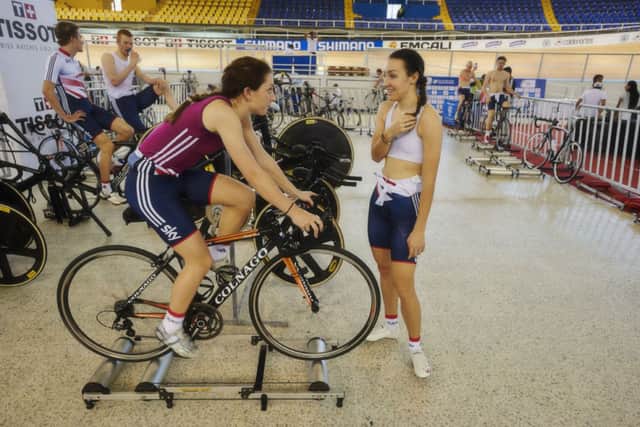 Laura Trott (on bike) chats to GB teammate Dani King after a training session in Cali. Picture: British Cycling