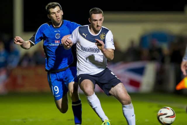 Rangers defender Lee Wallace (right) is kept in check by Martin Grehan. Picture: SNS