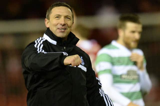 Aberdeen manager Derek McInnes hails the home fans after his sides 21 win over Celtic. Picture: SNS