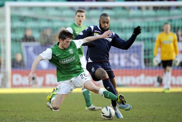 Sam Stanton takes on Yoann Arquin of Ross County. Picture: Greg Macvean
