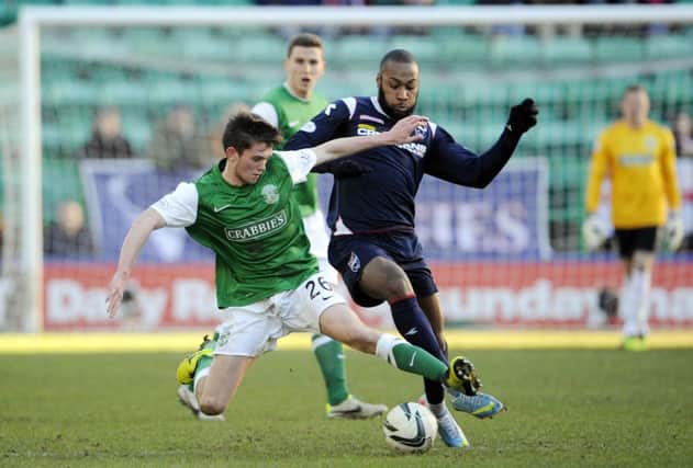 Sam Stanton takes on Yoann Arquin of Ross County. Picture: Greg Macvean