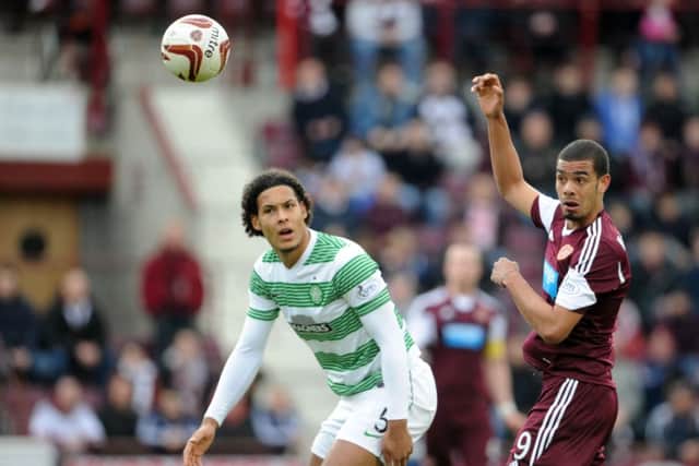 Paul McCallum tussles with Celtic's Virgil van Dijk at Tynecastle. Picture: Jane Barlow
