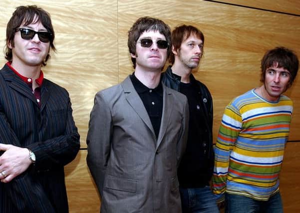 Oasis, pictured during happier times in 2005. The band are not reforming but are reissuing three albums. Picture: AP