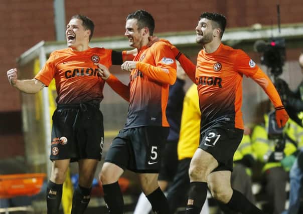 John Rankin, left, has signed a two-year contract extension with Dundee United. Picture: PA