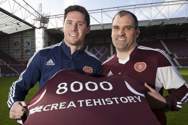 Dylan McGowan, left, congratulates fan Derek Shade on becoming the 8,000th contributor. Picture: SNS