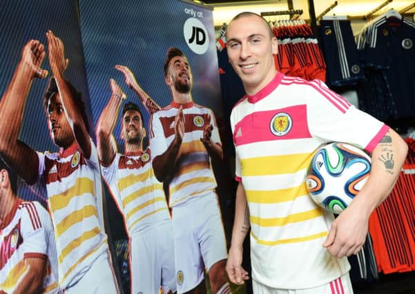 Scott Brown helps to launch the national side's new away kit for the UEFA EURO 2016 qualifying campaign. Picture: SNS