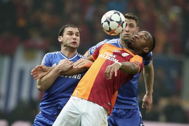 Didier Drogba of Galatasaray, front, and Branislav Ivanovic of Chelsea fight for the ball. Picture: AP