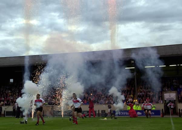 Edinburgh run onto the pitch to fireworks at the Myreside stadium in 2001. Picture: Andrew Stuart