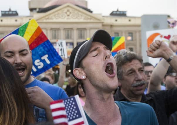 Demonstrators celebrate in Phoenix, Arizona. Picture AP