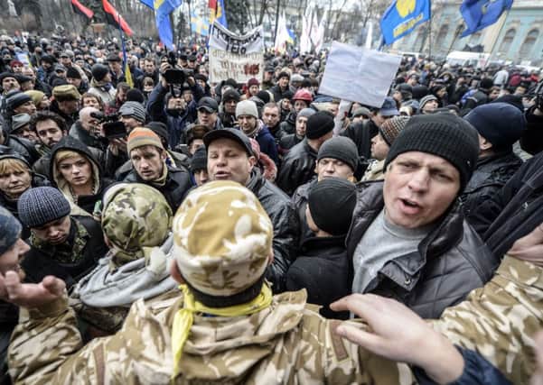 Ukrainians gather outside the parliament in Kiev. Picture: Getty