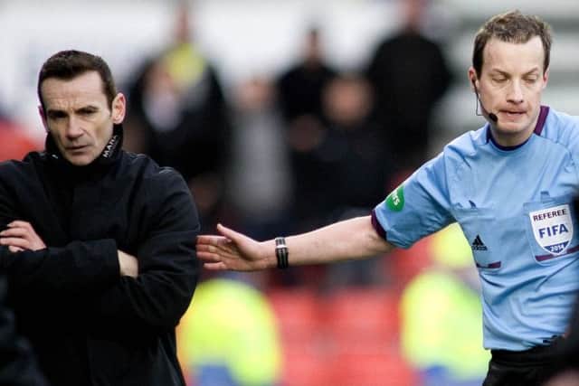 An unimpressed Danny Lennon is sent to the stand by Willie Collum. Picture: SNS
