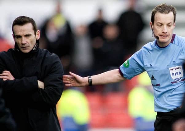 An unimpressed Danny Lennon is sent to the stand by Willie Collum. Picture: SNS