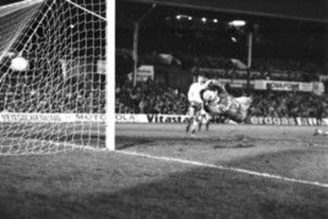 Bayern goalkeeper Raimond Aumann dives in vain as Iain Ferguson's shot flies past him. Picture: Bill Newton