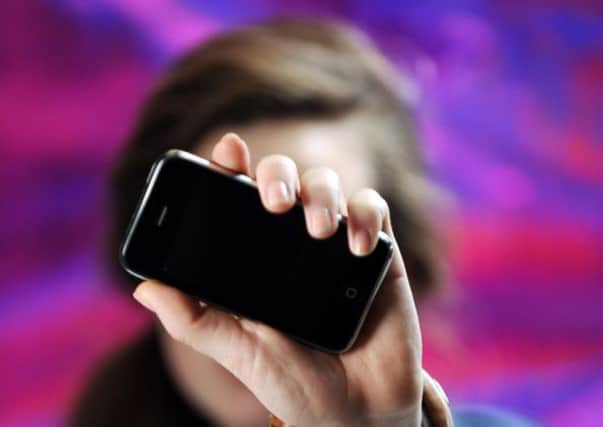 Many people find their life is focused around their iPhone. Picture: Phil Wilkinson