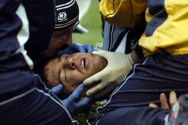 Rory Lamont is treated on the pitch before being taken to hospital in 2008. Picture:Jane Barlow
