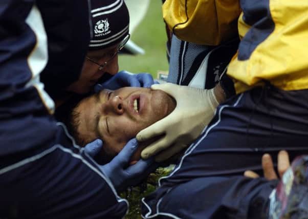 Rory Lamont is treated on the pitch before being taken to hospital in 2008. Picture:Jane Barlow