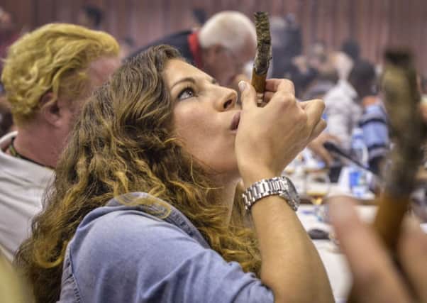 One of the estimated 1,500 smokers at the XVI Cigar Festival held in Havana. Picture: Getty Images