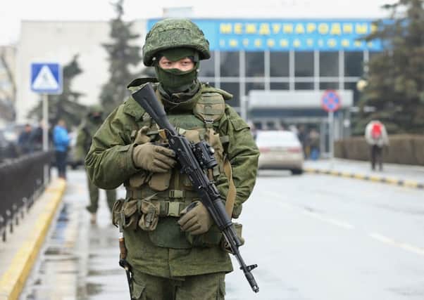 A man wearing military uniform with no identifying insignia outside Simferopol airport. Picture: Getty