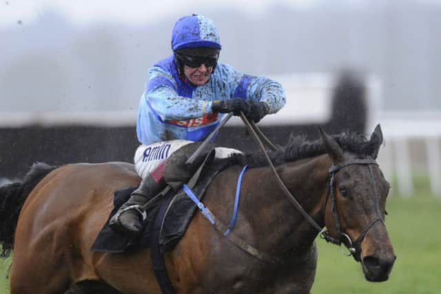 Richard Johnson rides Whispering Harry to victory at Newbury yesterday. Picture: Getty