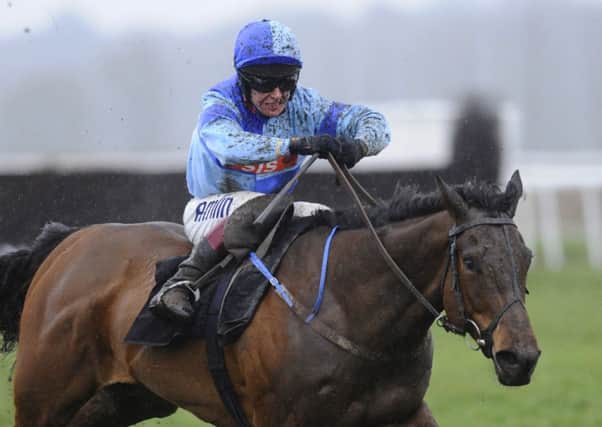 Richard Johnson rides Whispering Harry to victory at Newbury yesterday. Picture: Getty