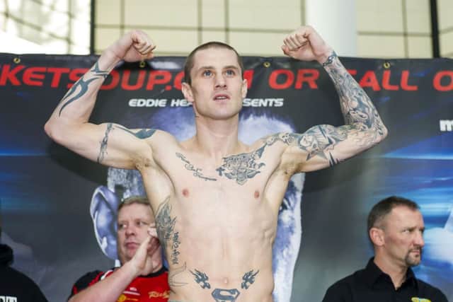 Champion Ricky Burns weighs-in ahead of his WBO lightweight title fight in Glasgow tonight. Picture: SNS