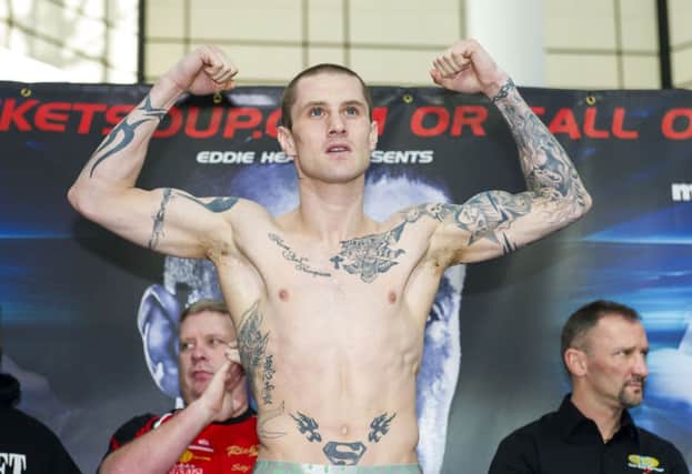 Champion Ricky Burns weighs-in ahead of his WBO lightweight title fight in Glasgow tonight. Picture: SNS
