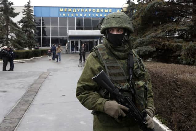 Gunmen wearing military uniforms without markings captured the airport in Simferopol. Picture: Getty