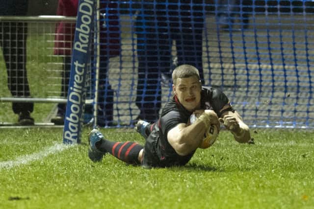 Hart dives over for his second try. Picture: SNS