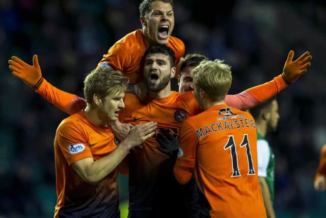 Dundee Utd's Nadir Ciftci (centre) celebrates his opening goal. Picture: SNS