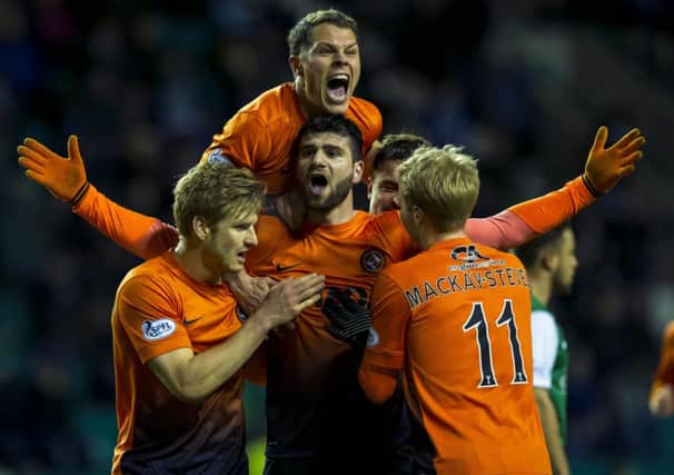 Dundee Utd's Nadir Ciftci (centre) celebrates his opening goal. Picture: SNS
